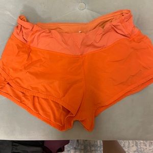 Orange Lululemon shorts
